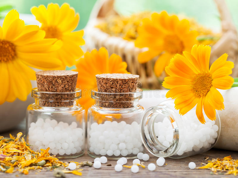 bottles-homeopathy-globules-marigold-flowers-three-57259301